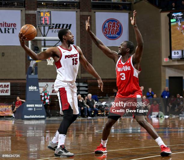Tony Mitchell of the Sioux Falls Skyforce looks to pass the ball against Durand Scott of the Memphis Hustle during an NBA G-League game on December...