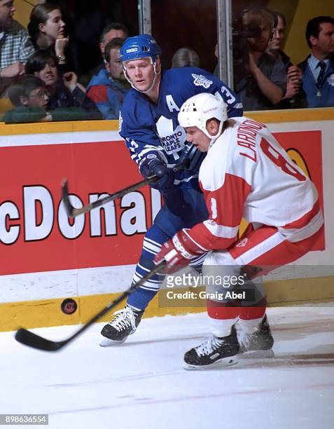 Igor Larionov of the Detroit Red Wings skates agains Mats Sundin of the Toronto Maple Leafs during NHL game action on March 20, 1996 at Maple Leaf...