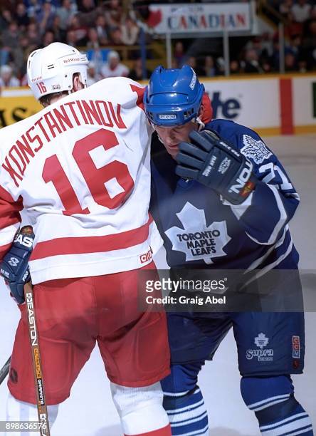Vladimir Konstantinov of the Detroit Red Wings mixes it up with Kirk Muller of the Toronto Maple Leafs during NHL game action on March 20, 1996 at...
