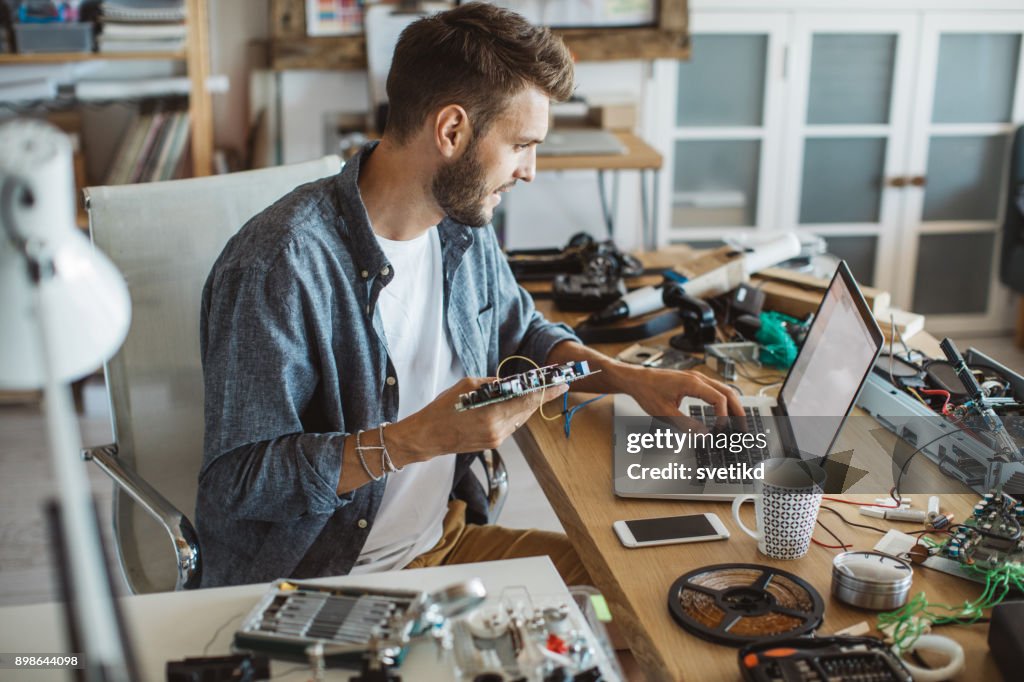 Man fixing electronic circuit