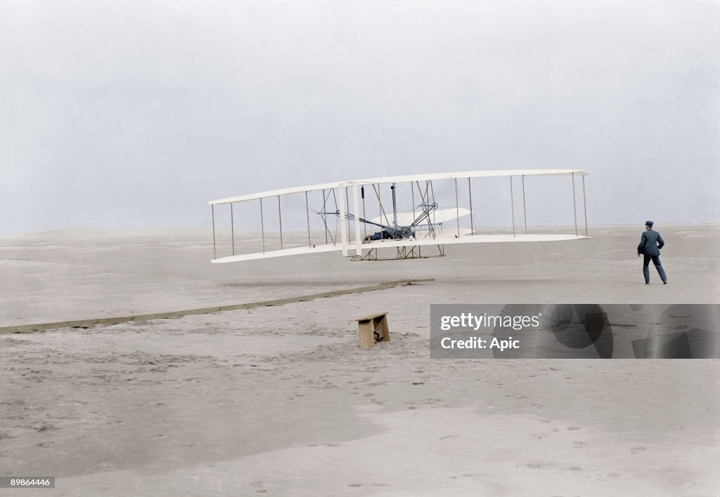 First flight of Orville Wright (1871-1948) at Kill Devil Hills, Kitty Hawk, North Carolina december 17, 1903 (120 feet in 12 seconds), his brother Wilbur Wright stand on the right