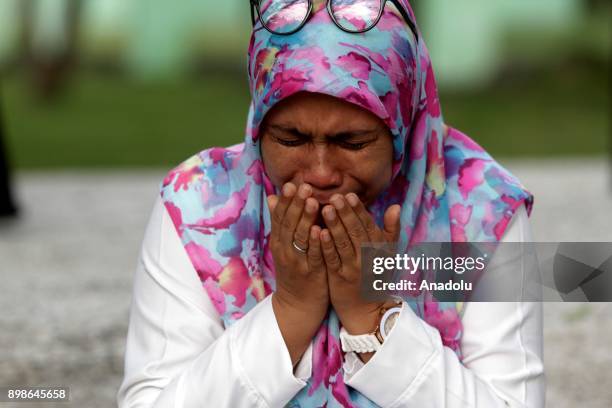 An Acehnese woman gestures during the 13th anniversary of Tsunami commemoration at Ulee Lheue, Banda Aceh, in Aceh, Indonesia on December 26, 2017....