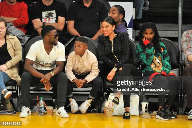 Comedian Kevin Hart, son Hendrix Hart, wife Eniko Parrish and daughter Heaven Hart attend a basketball game between the Los Angeles Lakers and the...