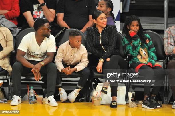 Comedian Kevin Hart, son Hendrix Hart, wife Eniko Parrish and daughter Heaven Hart attend a basketball game between the Los Angeles Lakers and the...