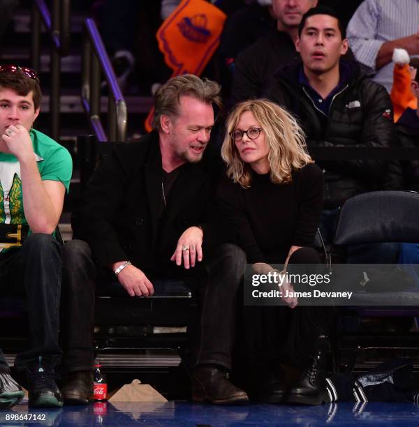 John Mellencamp and Meg Ryan attend the New York Knicks Vs Philadelphia 76ers game at Madison Square Garden on December 25, 2017 in New York City.