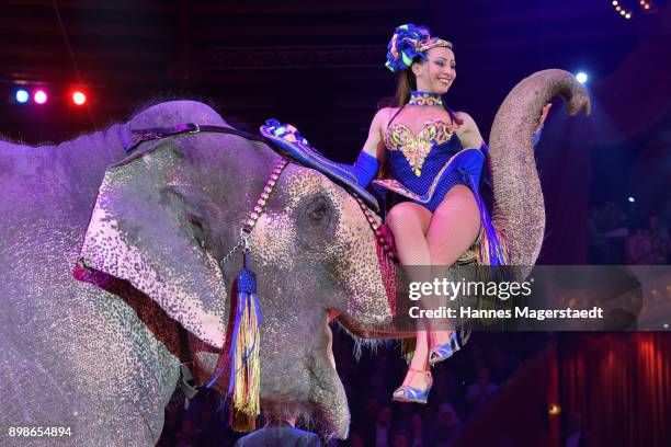 Jana Lacey-Krone performs with an elephant during Circus Krone celebrates premiere of 'In Memoriam' at Circus Krone on December 25, 2017 in Munich,...