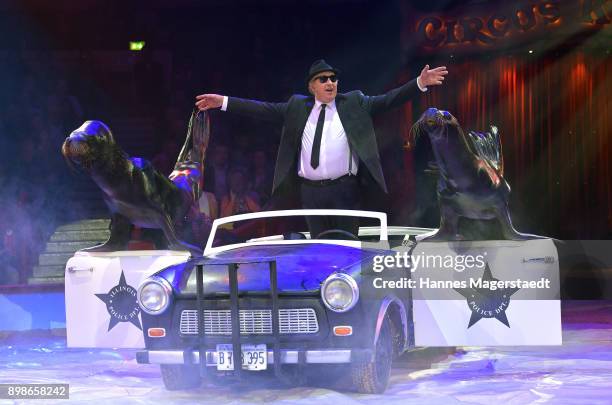 John Burke performs with his sea lions Lou and Micky during Circus Krone celebrates premiere of 'In Memoriam' at Circus Krone on December 25, 2017 in...