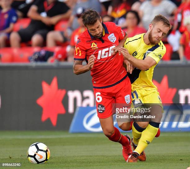 Vince Lia of United and Connor Pain of the Mariners compete for the ball during the round 12 A-League match between Adelaide United and the Central...