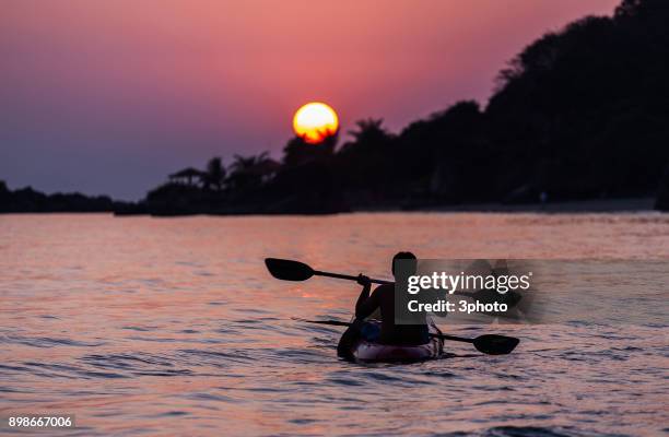 kayaks at the indian beach at sunset - palolem beach stock pictures, royalty-free photos & images