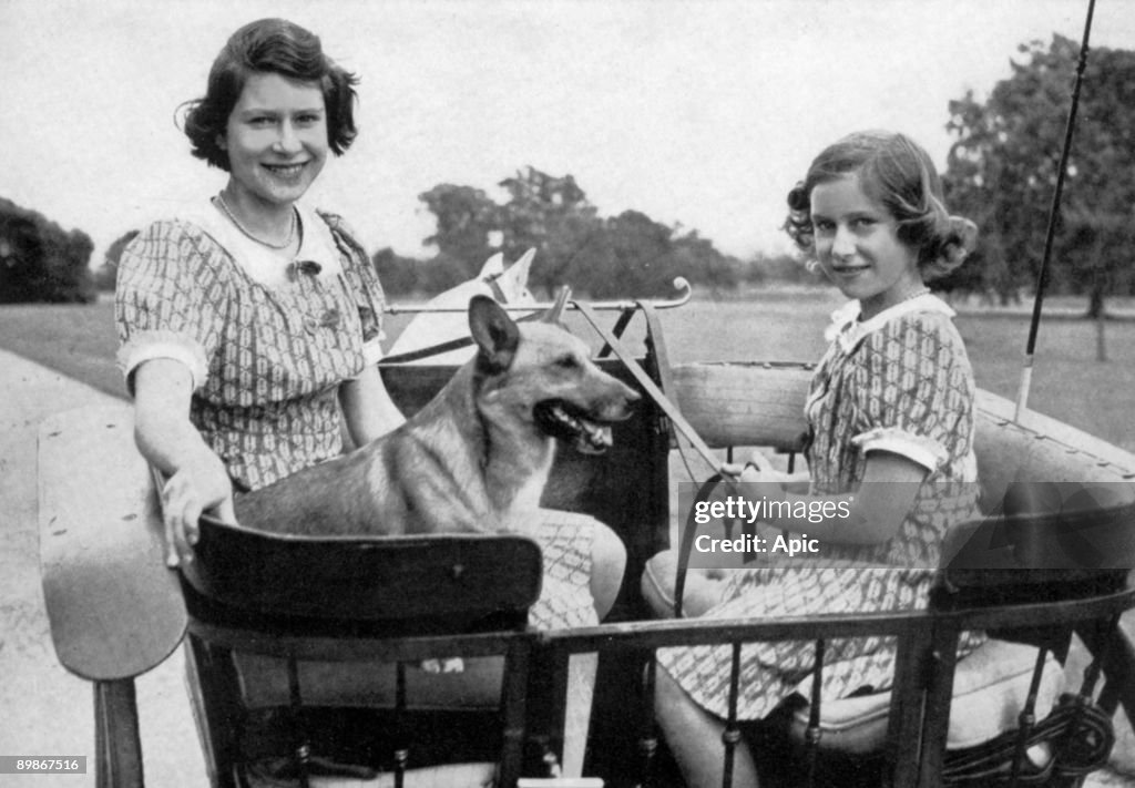 Princess Elizabeth of England (future queen Elizabeth II) and her sister princess Margaret in gradens of Windsor, 1941