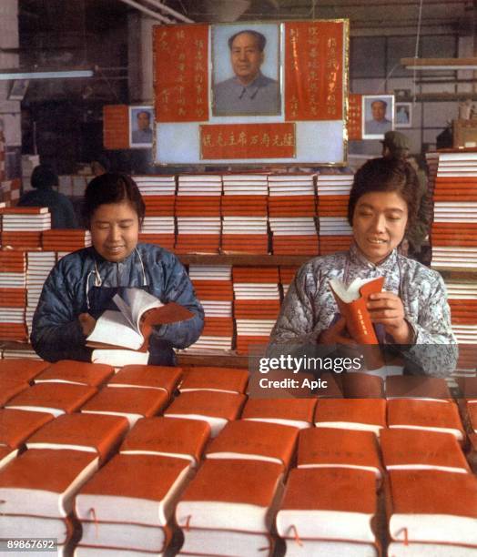 Chinese women at Sinhoua printing works in Pekin looking at exemplaries of The Little Red Book 1968