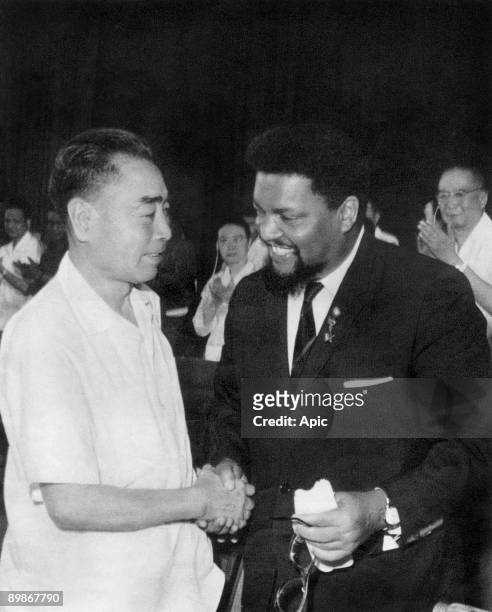 Chinese Prime Minister Zhou En-lai congratulates American Civil Rights leader Robert Franklin Williams following the latter's speech, Peking, China,...