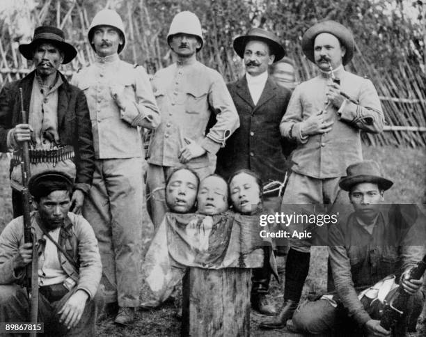 Three heads of beheaded chinese people. They have been executed for poisoning of french soldiers in north of Tonkin in 1908