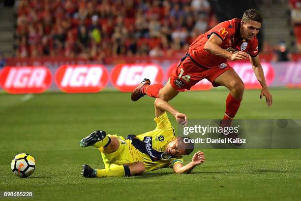 Alan Baro Calabuig of the Mariners and George Blackwood of United collide during the round 12 A-League match between Adelaide United and the Central...