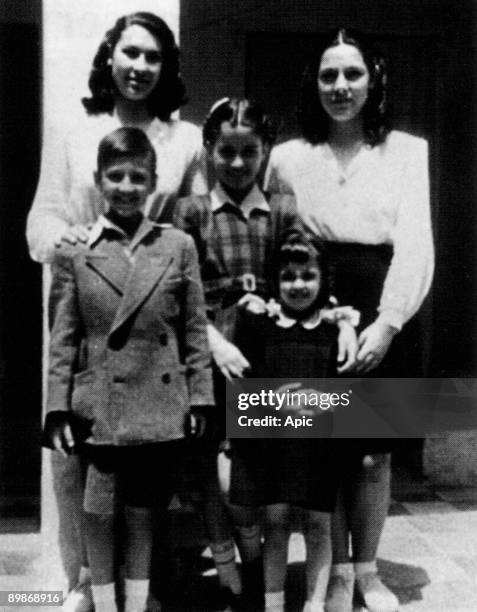 Singer Nana Mouskouri, young with her sister Eugenie aka Jenny and children of the owners of their house in Athens, 1946