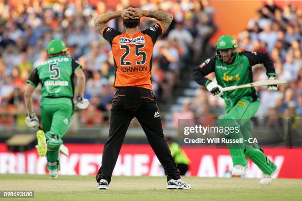 Mitchell Johnson of the Scorchers looks on as he concedes runs during the Big Bash League match between the Perth Scorchers and the Melbourne Stars...