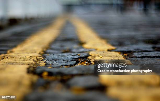 double yellow lines. - yellow line stock pictures, royalty-free photos & images