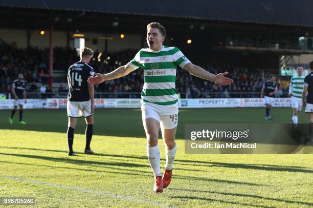 James Forrest of Celtic celebrates after scoring the opening goal during the Scottish Premier League match between Dundee and Celtic at Dens Park on...