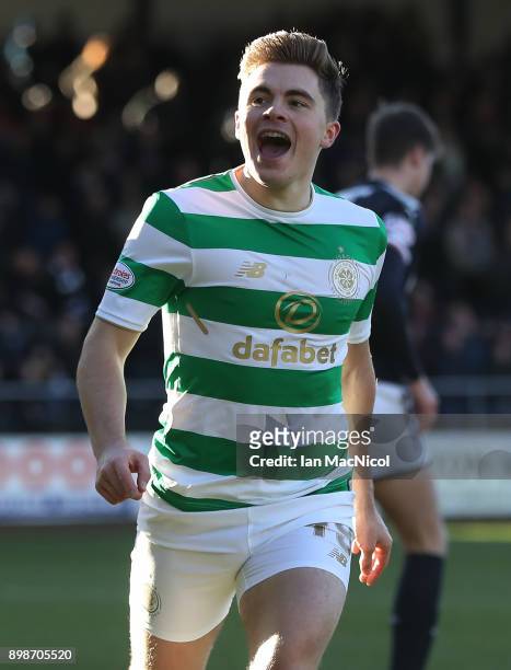 James Forrest of Celtic celebrates after scoring the opening goal during the Scottish Premier League match between Dundee and Celtic at Dens Park on...