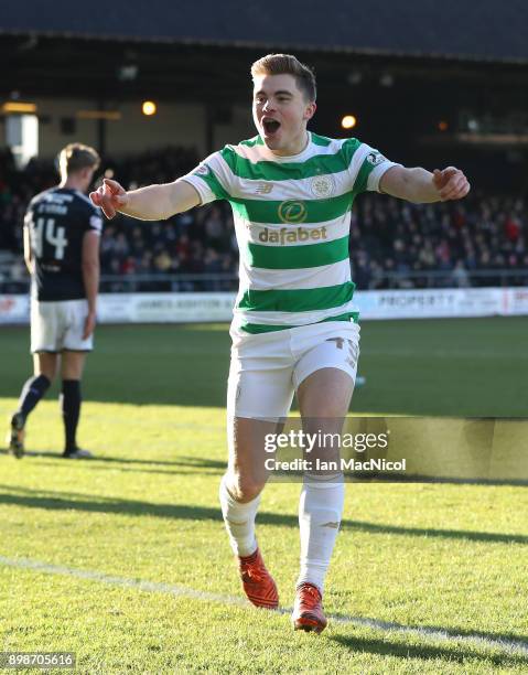 James Forrest of Celtic celebrates after scoring the opening goal during the Scottish Premier League match between Dundee and Celtic at Dens Park on...