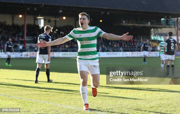 James Forrest of Celtic celebrates after scoring the opening goal during the Scottish Premier League match between Dundee and Celtic at Dens Park on...