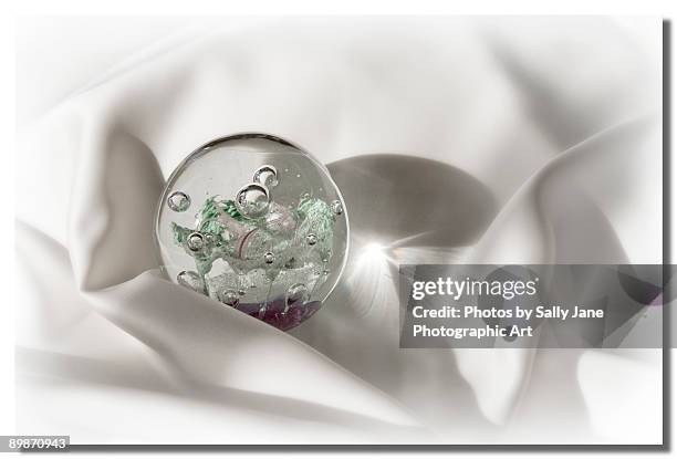 paperweight on satin - paperweight stock pictures, royalty-free photos & images