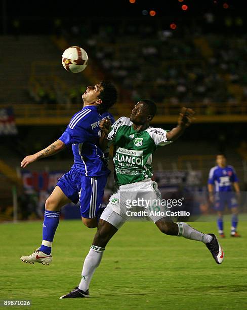 Duvier Riascos of Colombia's Deportivo Cali vies for the ball with Rafael Olarra of Chile's Universidad de Chile during their 2009 Copa Sudamericana...