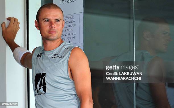 New Zealand cricketer Chris Martin watches from the balcony dressing room during the second day of the first Test match between Sri Lanka and New...