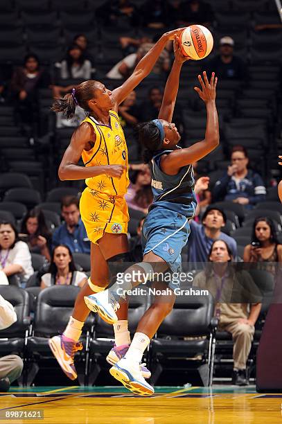 Lesa Leslie of the Los Angeles Sparks blocks the shot from Monique Currie of the Washington Mystics on August 18, 2009 at Staples Center in Los...