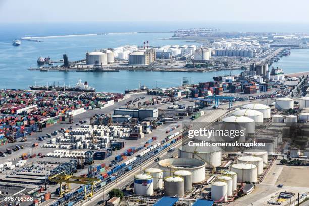 liquid gas storage tanks with cargo container in harbour, barcelona - gasoline storage stock pictures, royalty-free photos & images