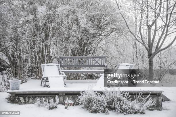 chairs in the snow - trond topstad stock pictures, royalty-free photos & images