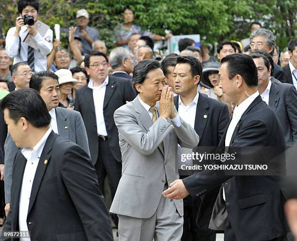 Japan's main opposition Democratic Party of Japan leader Yukio Hatoyama , surrounded by security policemen, arrives at rally for his party's young...