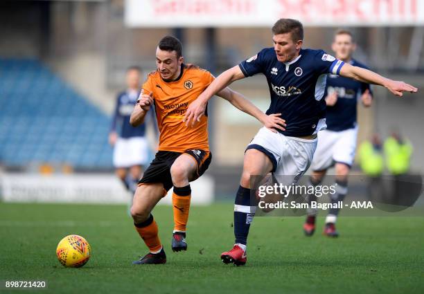 Diogo Jota of Wolverhampton Wanderers and Shaun Hutchinson of Millwall during the Sky Bet Championship match between Millwall and Wolverhampton at...