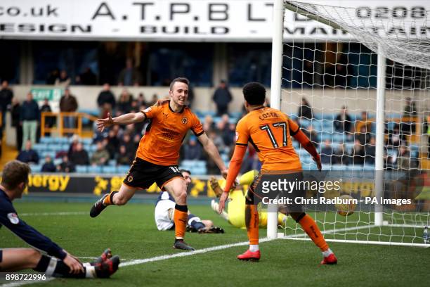 Wolverhampton Wanderers Diogo Jota celebrates his with team mate Helder Costa goal l during the Sky Bet Championship match at The New Den, London.