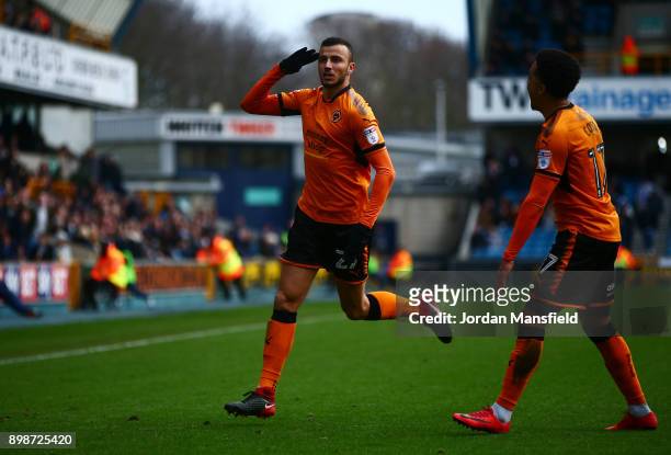 Romain Saiss of Wolves celebrates scoring his sides second goal during the Sky Bet Championship match between Millwall and Wolverhampton at The Den...