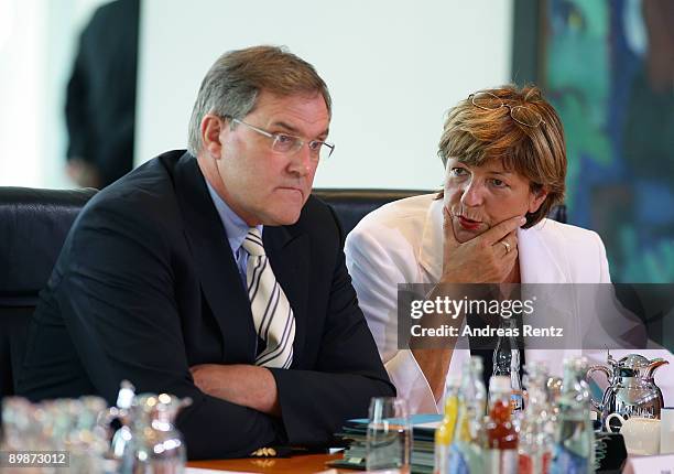 German Health Minister Ulla Schmidt talks to German Defense Minister Franz Josef Jung prior to the weekly German government cabinet meeting at the...