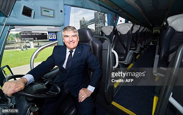 Chief Executive of FirstGroup Sir Moir Lockhead unveils one of the new Greyhound buses at the launch of the service near Tower Bridge, in central...