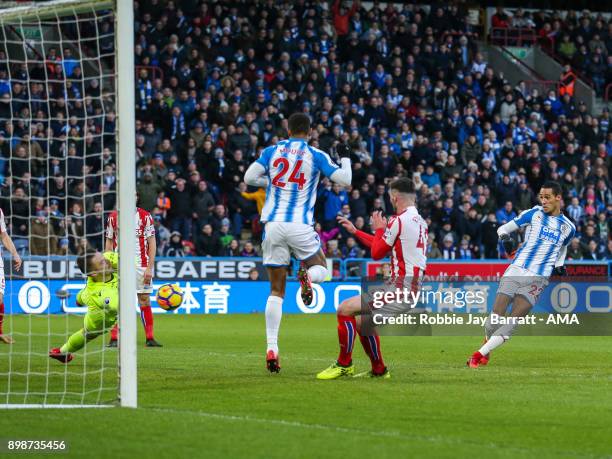 Tom Ince of Huddersfield Town scores a goal to make it 1-0 during the Premier League match between Huddersfield Town and Stoke City at John Smith's...