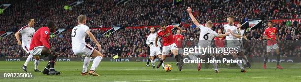 Juan Mata of Manchester United in action with Ben Mee of Burnley during the Premier League match between Manchester United and Burnley at Old...