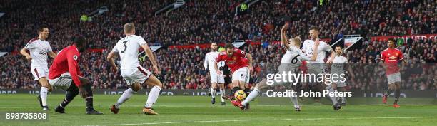 Juan Mata of Manchester United in action with Ben Mee of Burnley during the Premier League match between Manchester United and Burnley at Old...