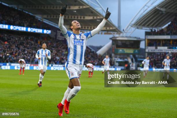 Tom Ince of Huddersfield Town celebrates after scoring a goal to make it 1-0 during the Premier League match between Huddersfield Town and Stoke City...