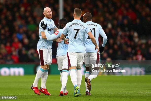 James Collins of West Ham United celebrates with teammates after scoring his sides first goal during the Premier League match between AFC Bournemouth...