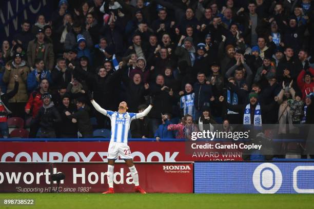 Tom Ince of Huddersfield Town celebrates after scoring his sides first goal during the Premier League match between Huddersfield Town and Stoke City...