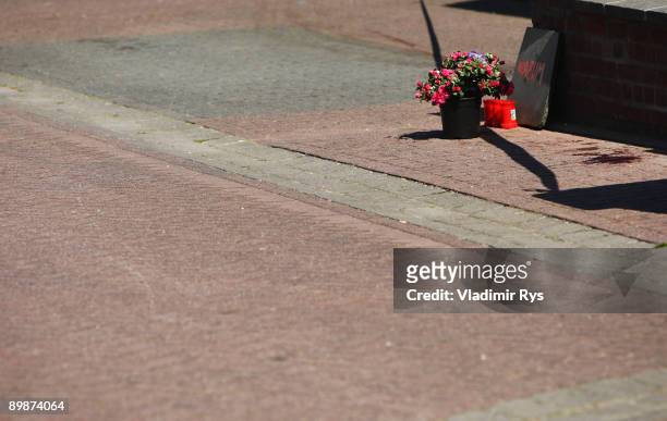 Flowers, candles and a message saying 'Why?' seen in front of the crime scene on August 19, 2009 in Schwalmtal near Duesseldorf, Germany. A German...