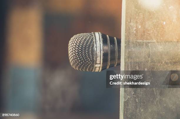 vintage microphone on window - micrófono de condensador fotografías e imágenes de stock