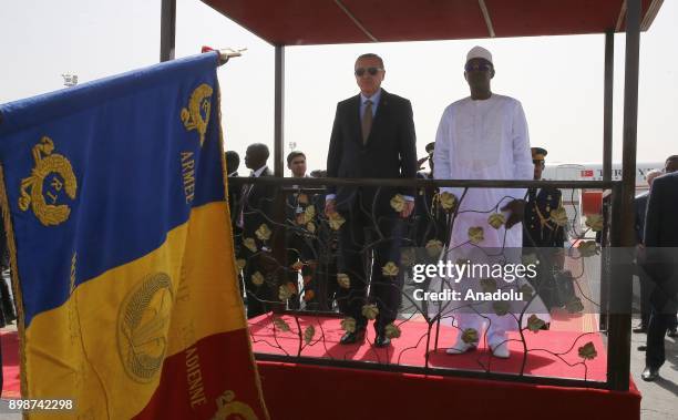 Turkish President Recep Tayyip Erdogan stands next to President of Chad Idriss Deby during a welcoming ceremony upon his arrival with the private...