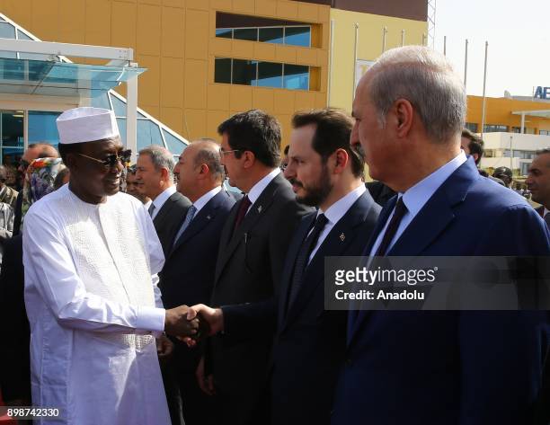 President of Chad Idriss Deby shakes hands with Chief of the General Staff of the Turkish Armed Forces Hulusi Akar , Turkish Foreign Minister Mevlut...