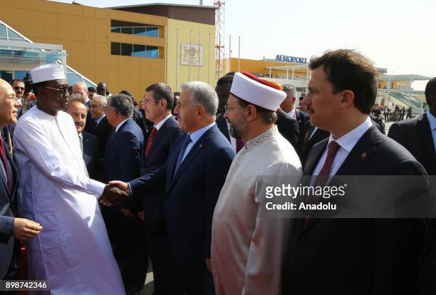 President of Chad Idriss Deby shakes hands with Turkish Defense Minister Nurettin Canikli , Turkish Transport, Maritime Affairs and Communications...