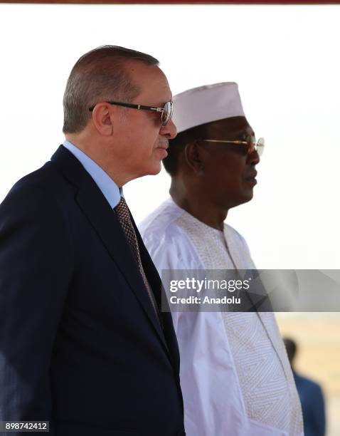 Turkish President Recep Tayyip Erdogan stands next to President of Chad Idriss Deby during a welcoming ceremony upon his arrival with the private...