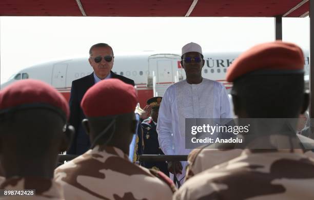 Turkish President Recep Tayyip Erdogan stands next to President of Chad Idriss Deby during a welcoming ceremony upon his arrival with the private...